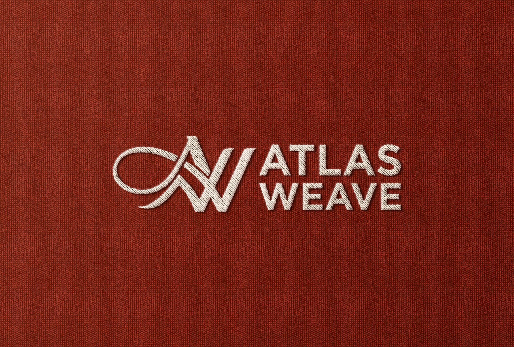 The Atlas Weave mark embroidered into premium burgundy textile